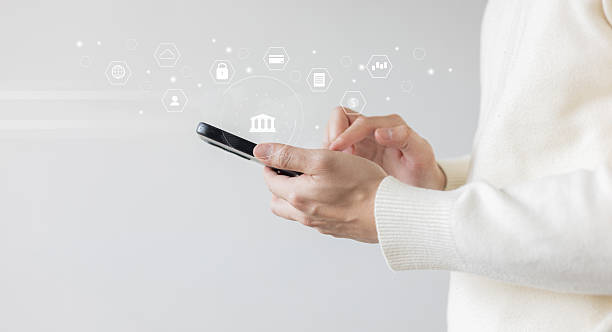 istock closeup user nam hand hold smartphone to use financial application about virtual banking with multifunction of transaction ,trade and security for future business concept 2214179910