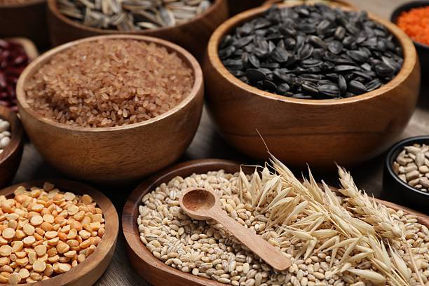 istock Different types of cereals and seeds on table, closeup 2214181326