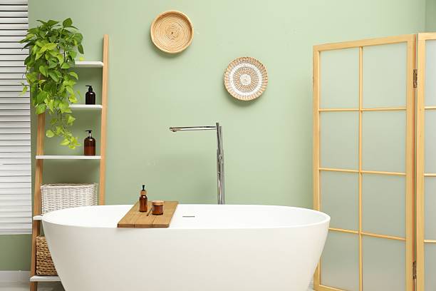 istock Stylish bathroom interior with folding screen and tub 2214182913