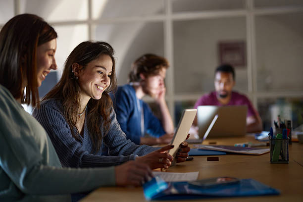 istock Happy creative women working on touchpad during a meeting in the office. 2214183334