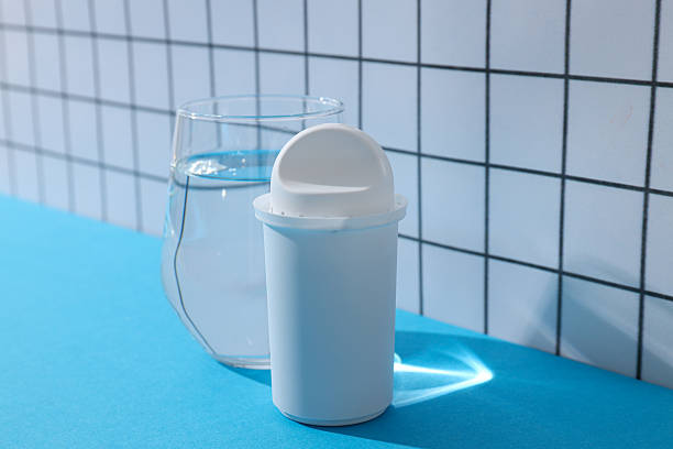 istock A water filter with a glass on a light background 2214183402