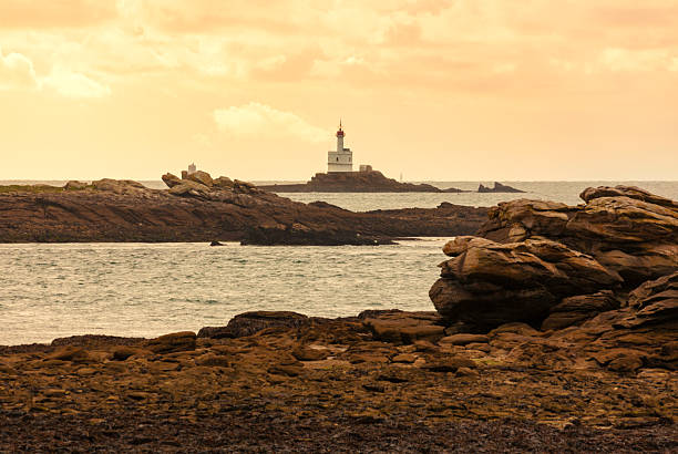 Phare de la Teignouse lighthouse, view from Pointe du Conguel on Quiberon peninsula at dawn