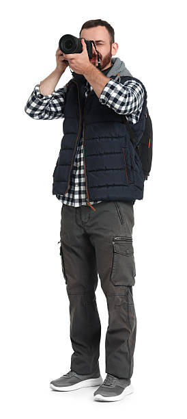 istock Photographer with backpack and camera taking picture on white background 2214186453