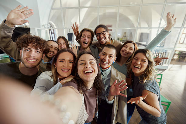 istock Happy creative team taking a selfie in a modern office. 2214186922