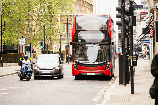Front view of a red double decker bus in London street
