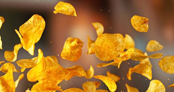 istock Flying Pepper Potato Chips, Fried Potatoes Flying up in the Air. 2214188873