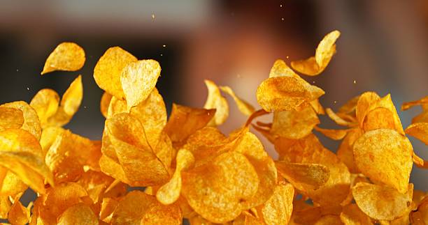 istock Flying Pepper Potato Chips, Fried Potatoes Flying up in the Air. 2214188890