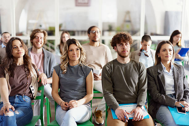 istock Creative people attending an education event in modern office. 2214190373