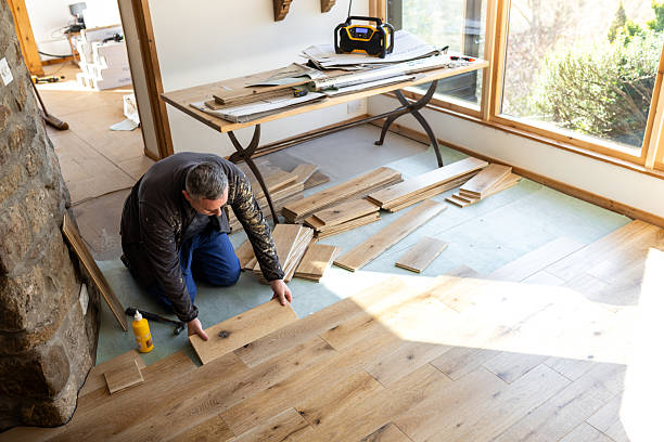 Professional Carpenter Installing Hardwood Flooring