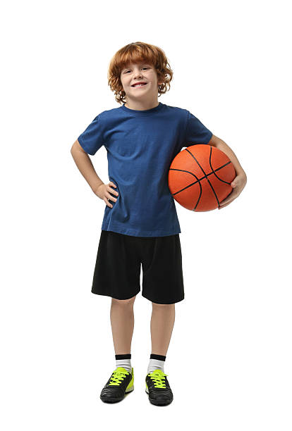 istock Little boy with basketball ball on white background 2214192114