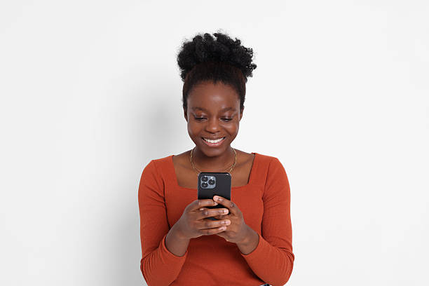 istock Happy woman with smartphone on white background 2214192686