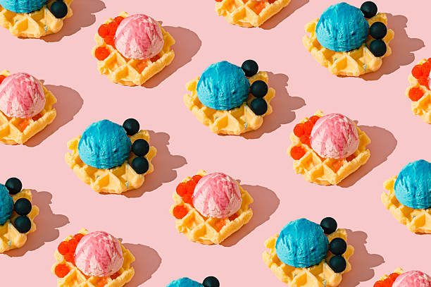 istock Seamless waffle pattern with pink and blue ice cream scoops and raspberries or blueberries on pastel pink background. Sweet and playful dessert themed texture for backgrounds or summer visuals. 2214194153