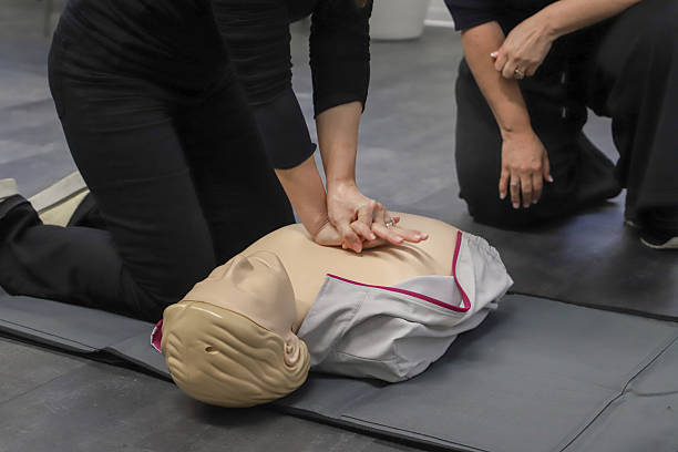 istock first aid course - company safety - cardiac massage - Basic Life Support 2214194611