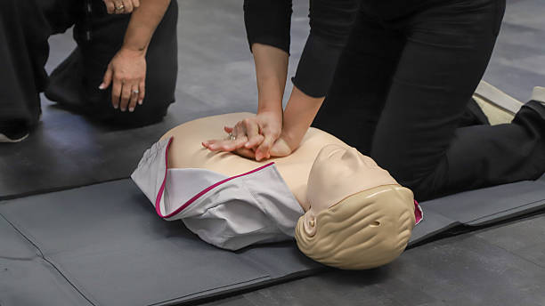 istock first aid course - company safety - cardiac massage - Basic Life Support 2214194626