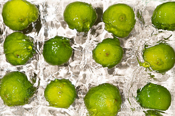 istock Fresh Whole Limes Floating in Water Top View 2214197967