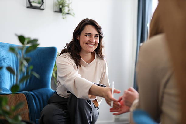istock Caucasian female therapist engaging with patient in cozy office setting 2214200050