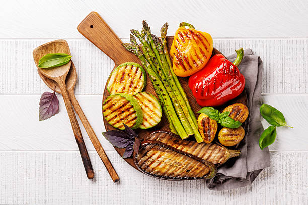 istock Assorted grilled vegetables including bell peppers, zucchini, eggplant, and asparagus 2214200388