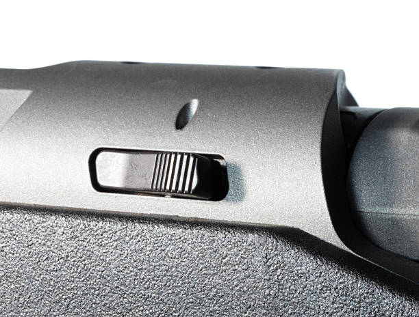 istock Bolt release bar on a bolt action rifle with a black polymer stock 2214200845