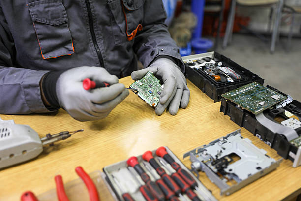 istock Senior technician repairing and cleaning a computer. 2214202274