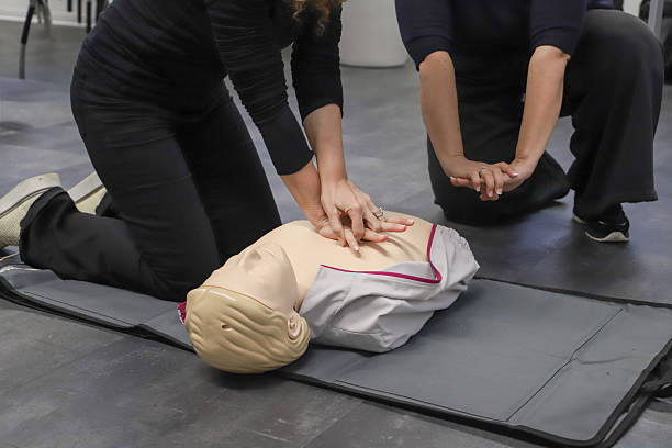 istock first aid course - company safety - cardiac massage - Basic Life Support 2214205244