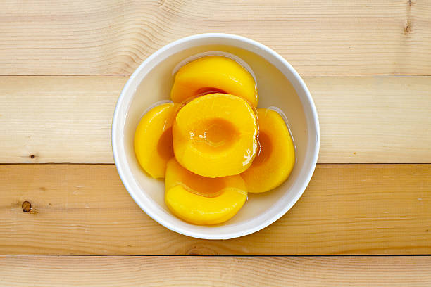 istock Peach halves in syrup. Fruity desserts 2214211969