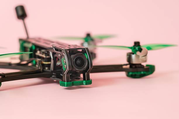istock Close up view on modern drone with camera isolated on pink background 2214212795