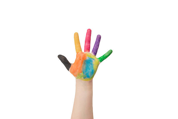 istock Child's hand painted with multicolored finger paints on white background 2214213262