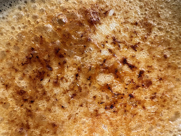 Bubbly texture of a golden-brown creme brulee as it cooks