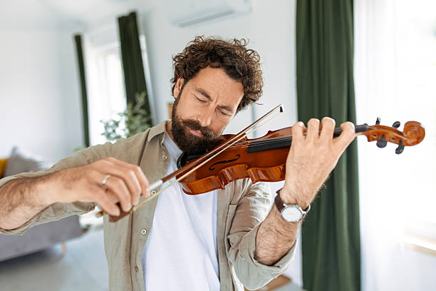 istock Violinist in Cozy Home Setting 2214214737