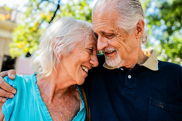 istock Senior couple embracing outdoors 2214219024