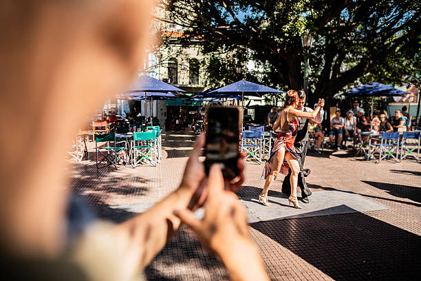 istock Dancers being filmed during a tango performance in the city 2214219079