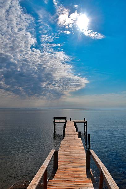 istock Chesapeake Bay fishing pier, altocumulus clouds and sun 2214220197