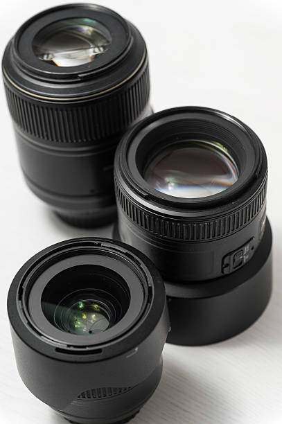 istock Close-up of three black camera lenses on table 2214221013