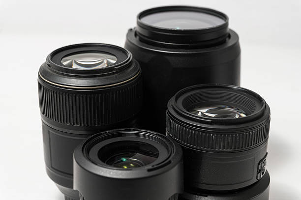 istock Close-up of four camera lenses on white background. 2214221016