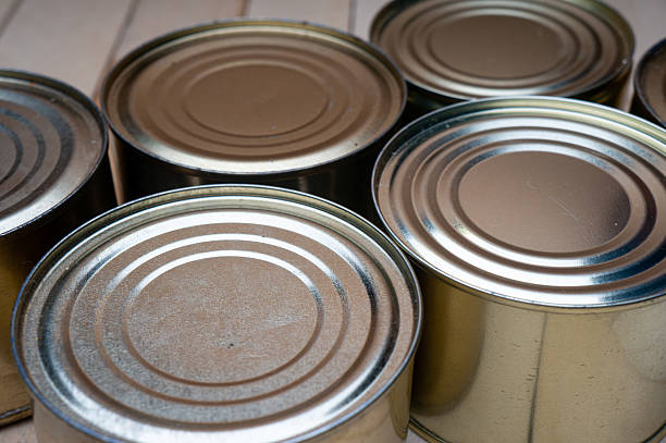 istock Round tin cans with food on the surface 2214224624