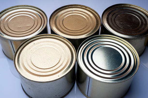 istock Round tin cans with food on the surface 2214224689