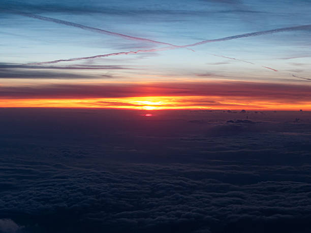 istock Sky over the clouds on sunrise from airplane 2214226858