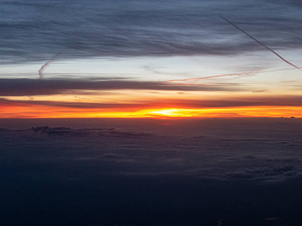 istock Sky over the clouds on sunrise from airplane 2214226861
