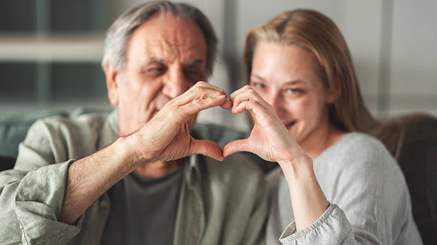 istock Father and daughter making a heart shape with their hands 2214229119