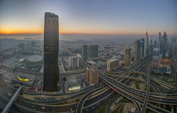 istock Sunset over Dubai skyline with highways and skyscrapers 2214233584