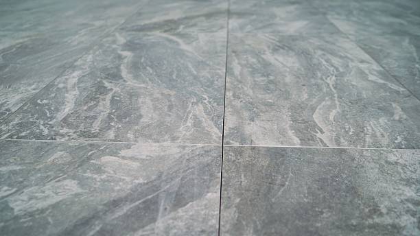 istock Gray marble effect floor tiles creating modern interior design 2214234218
