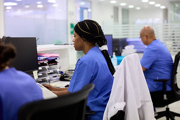 istock The nurse is busy with computer work at the hospital's reception. 2214239804