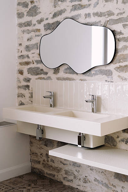istock Modern bathroom interior design with dual sinks and stylish mirror 2214241903