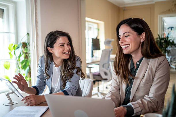 istock Two businesswomen collaborating on project in modern office 2214242129