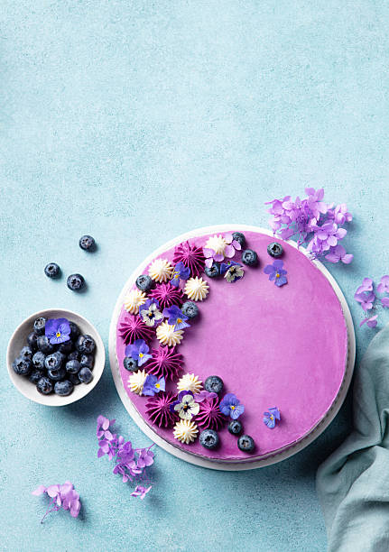 istock Blueberry cake with fresh berries and cream. Blue background. Copy space. Top view. 2214246880