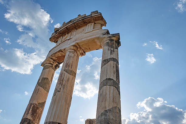 Ruins of an ancient temple, Temple Of Apollo At Delphi Oracle, Greece, ncient greek columns against blue sky
