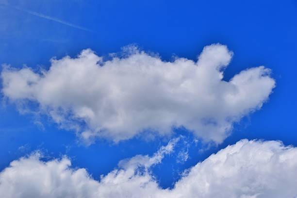 istock Cumulus clouds in a blue sky 2214247226