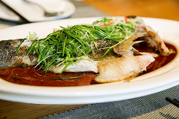 Steamed fish chinese cuisine cantonese style dish closeup view