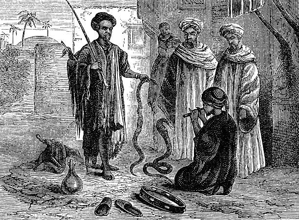 Snake charmers performing on the street in Cairo, Egypt. Vintage etching circa 19th century.