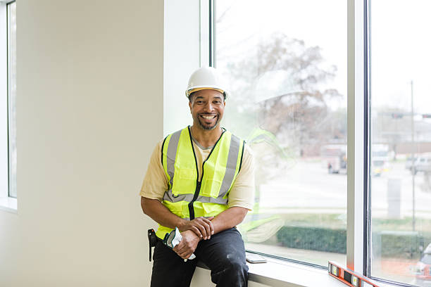 istock Happy Construction Worker Smiling in New Building 2214250707